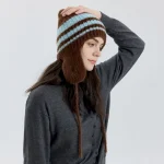 Wholesale Women Fashion Casual Color Matching Stripe Lace-Up Warm Ear Protection Knitted Wool Hat - Image 2